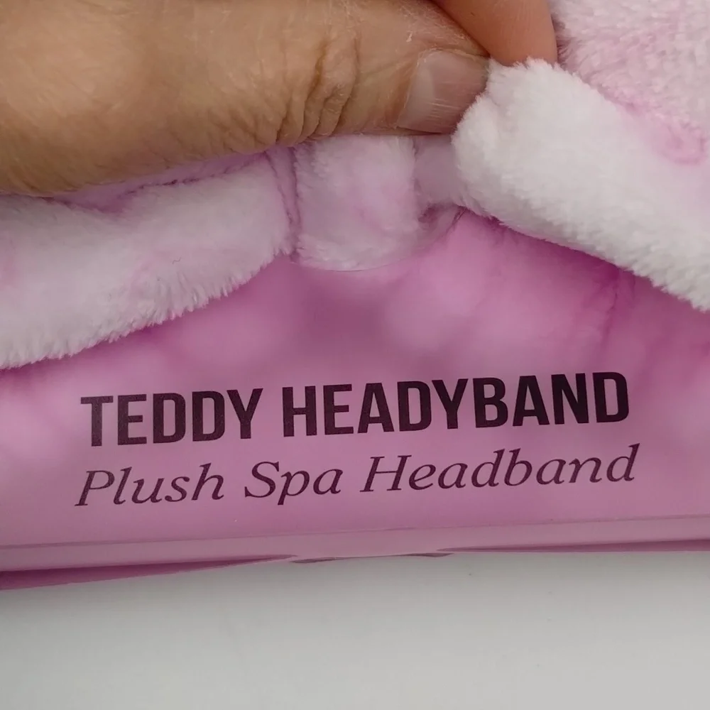 the Crème Shop teddy headband pink with smiley faces plush spa